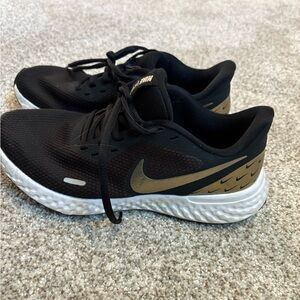 Nike Black Sneakers with Gold Details